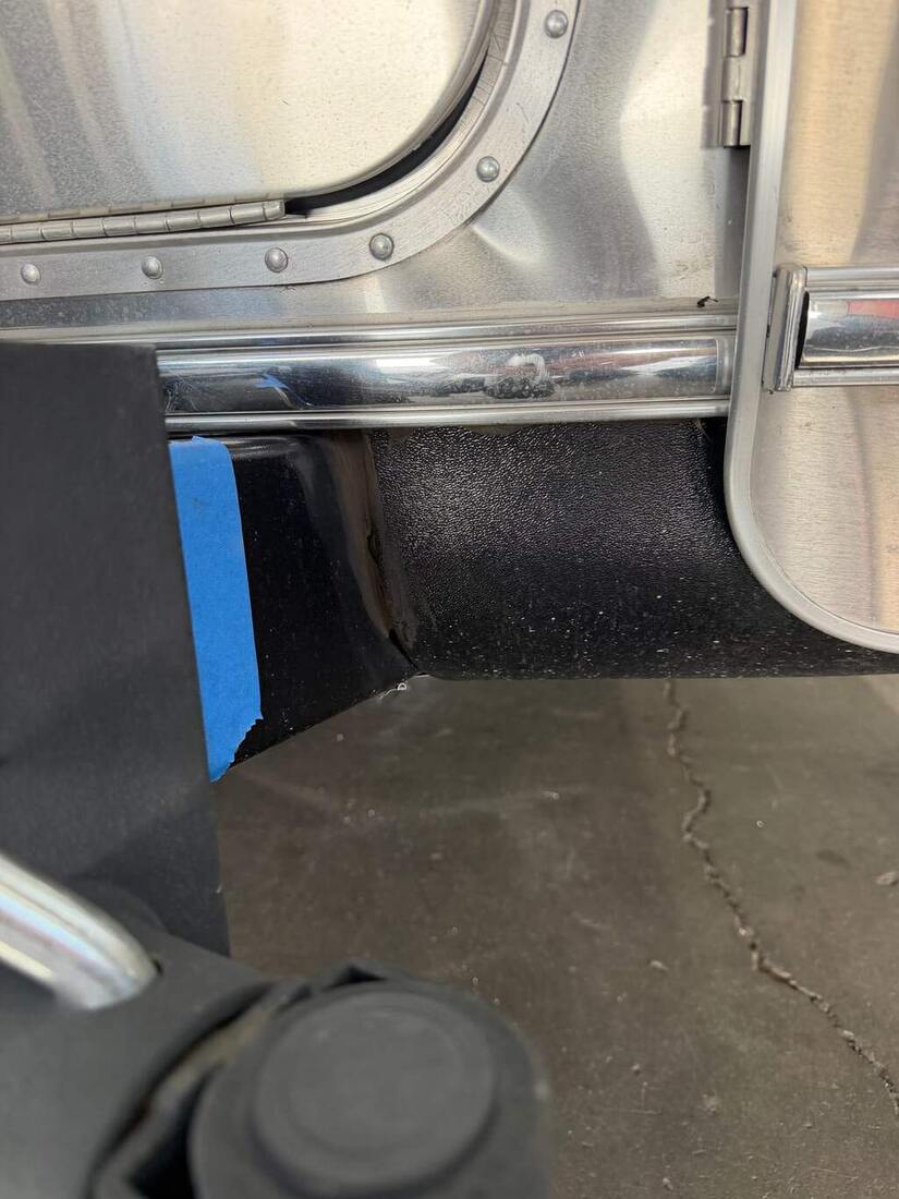 Separation gap visible at the rub-rail seam