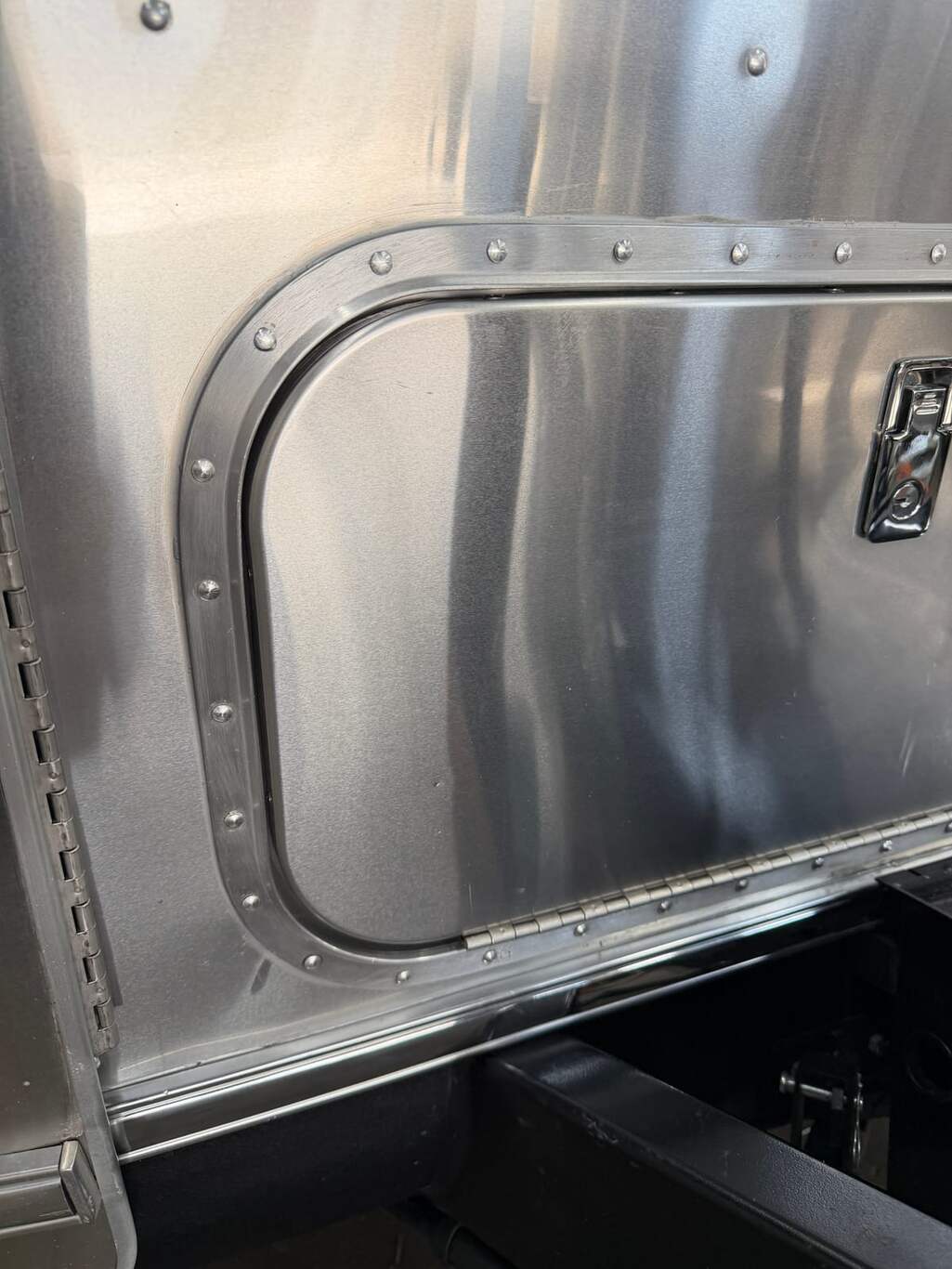 Storage compartment door reinstalled flush